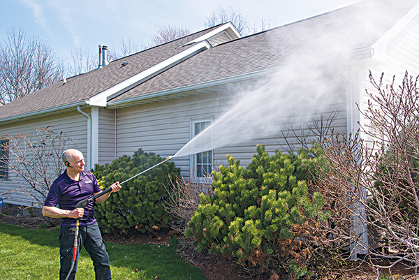 Can I wash windows with my pressure washer?