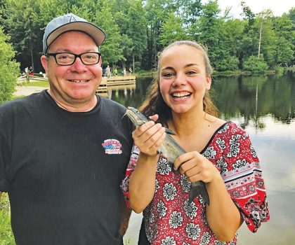 Family Fishing Frenzy Father And Daughter With Catfish 300 Dpi