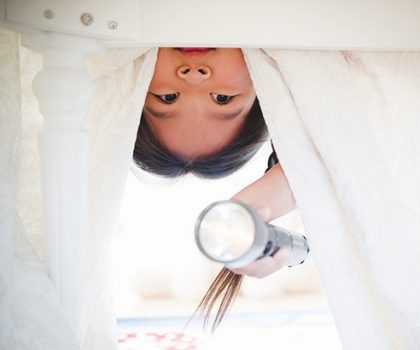 Little Girl Looking Under Bed